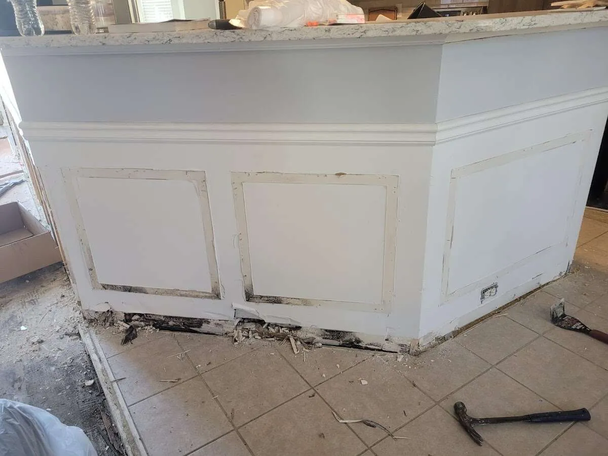 Water damage and mold on kitchen during Burst Pipe Cleanup in Upper Grand Lagoon